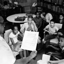 Teacher holding a "Freedom Diploma" at a Freedom School, 1963